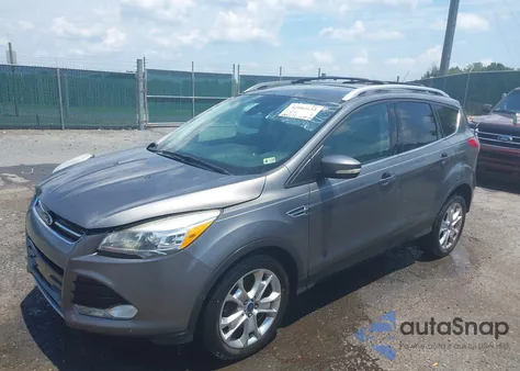 2014 Ford Escape Titanium z USA, uszkodzony, nr VIN 1FMCU0J9XEUC10891